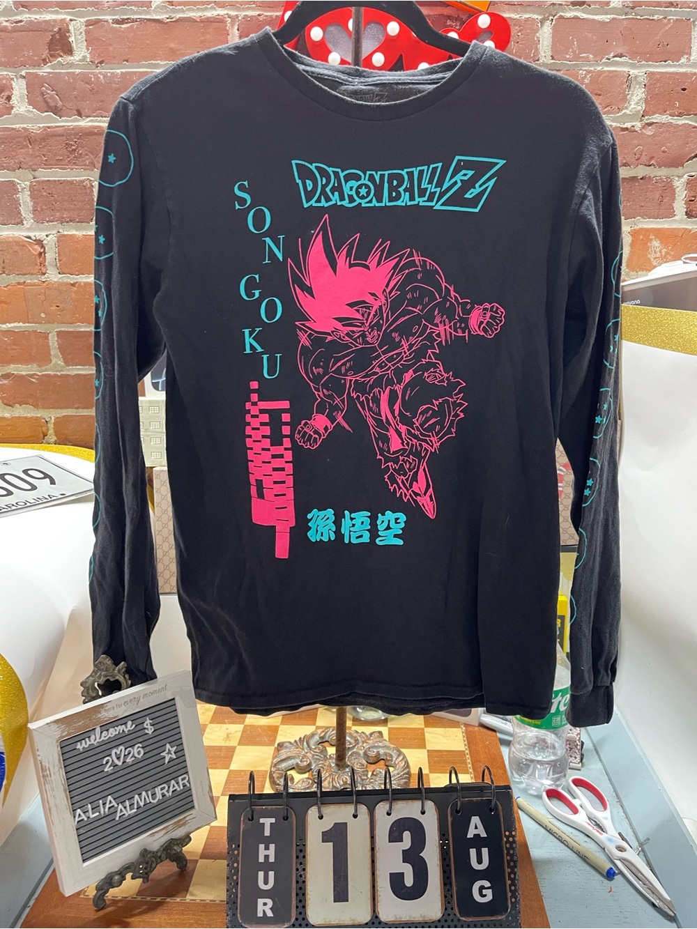 black Dragon Ball Z Son Goku long-sleeve t-shirt features a vibrant pink graphic